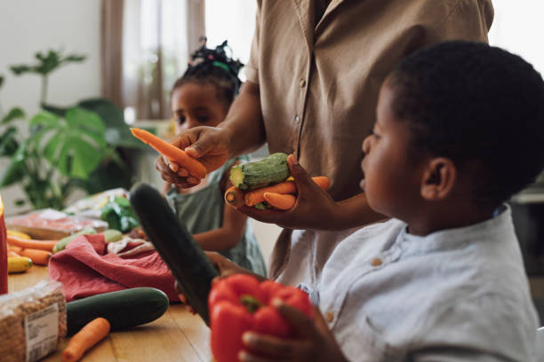 istock Mother Teaching Her Kids about Vegetables 1310168633
