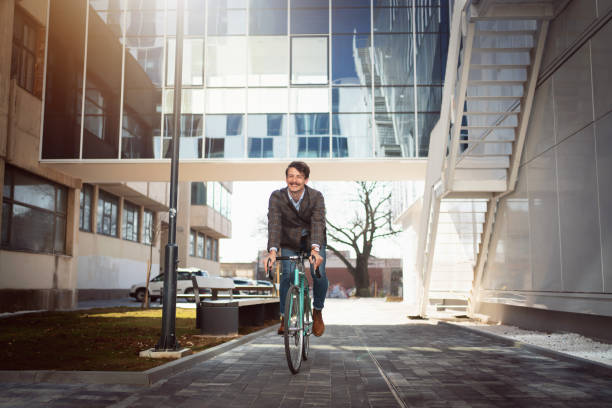 istock Young businessman cycling on his way to work 1310168872