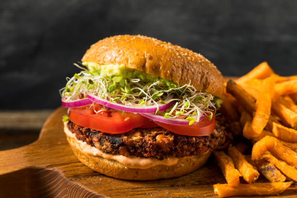 Healthy Organic Vegan Quinoa Burger Healthy Organic Vegan Quinoa Burger with Veggies and French Fries veggie burger photos stock pictures, royalty-free photos & images