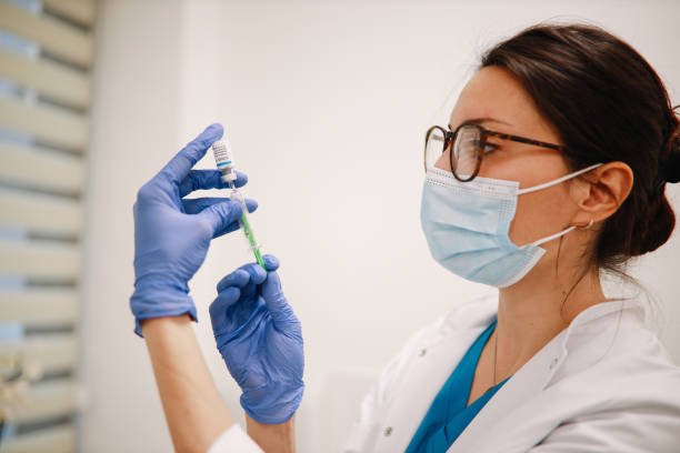 istock Nurse preparing the vaccination equipment 1310169654