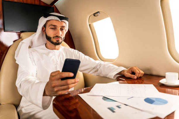 istock Arabian man wearing kandora flying on private jet 1310169662