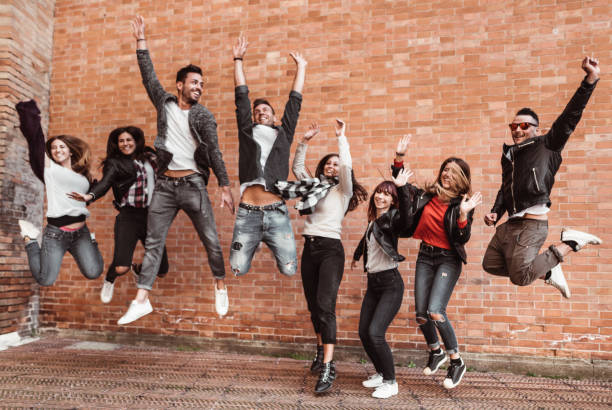 istock happiness friends jumping all together 1310171738