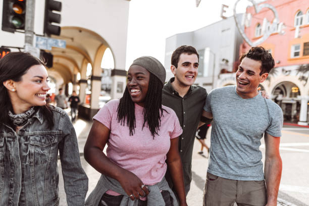 istock friends walking all together on venice beach 1310173603