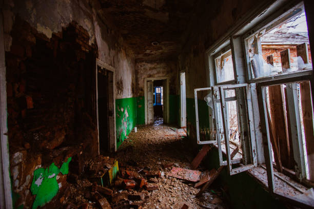 istock Dark creepy corridor of abandoned building 1310174344