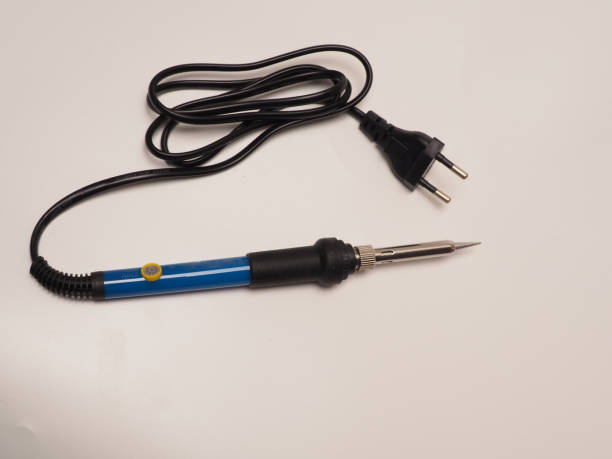 istock Close up shoot of soldering iron, a tool for soldering electrical components 1310175563
