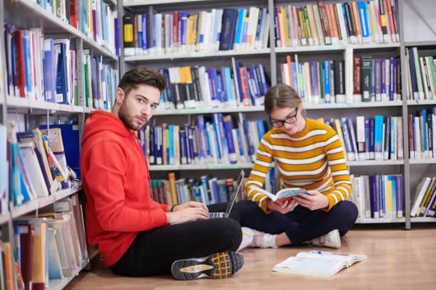 istock the students uses a notebook, laptop and a school library 1310177514