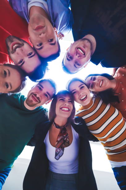 istock group of happy young people showing their unity 1310178840
