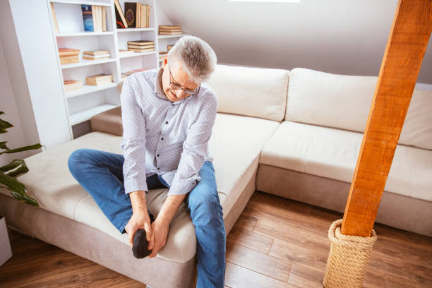 istock Senior man suffering with foot cramp 1310179675