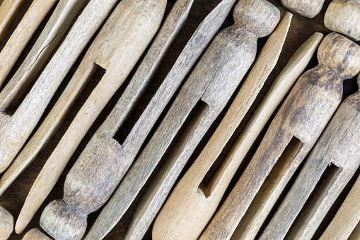 Close-up image of old wood clothespins.