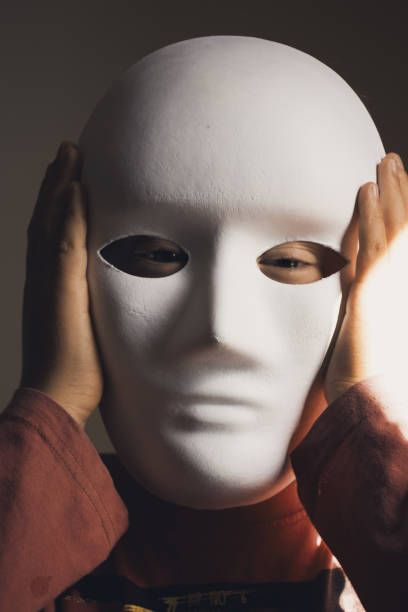 istock Child in Blank Mask for a Face Recognition Concept 1310180895