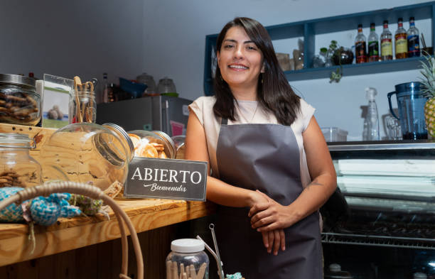 istock Woman places open sign in her cafeteria 1310181708