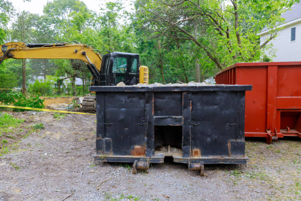 istock Under construction with excavator bucket on construction trash dumpsters in an metal container, home house renovation. 1310182557
