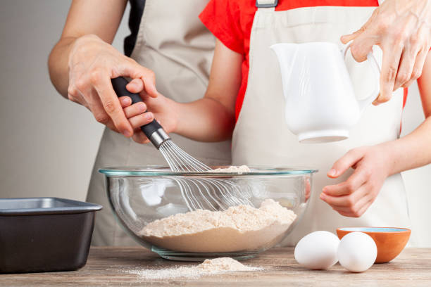 istock mother and daughter cooking togehter 1310182584