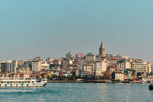 Famous galata tower of istanbul taken photo from istanbul bosporus. Turkey istanbul 04.03.2021. Famous galata tower of istanbul taken photo from istanbul bosporus. it is established by genoese sailors for watching of bosporus of constantinople. galata tower photos stock pictures, royalty-free photos & images