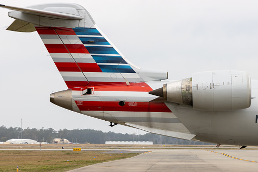Myrtle Beach, South Carolina - March 17, 2021: The tail of an American Airlines plane on the tarmac of an airport.
