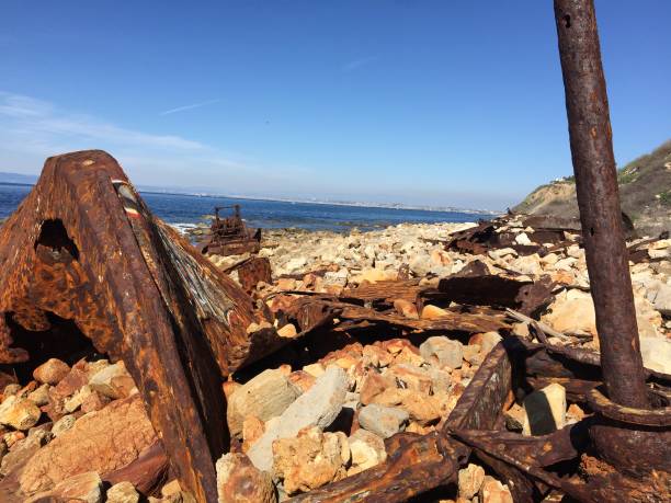 istock Rocky Coast with a rusted old ship 1310190505