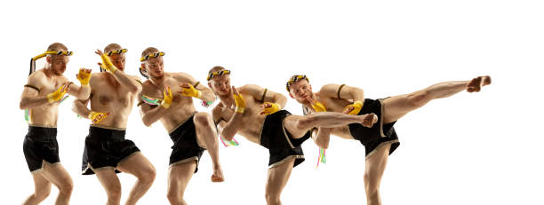 istock Young man thai boxer on white background in motion of step to step leg kicking. 1310191298