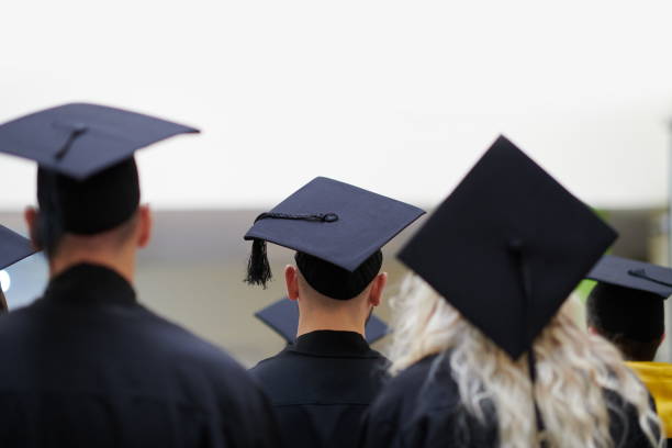 istock Group of diverse international graduating students celebrating 1310193864