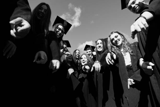 istock Group of diverse international graduating students celebrating 1310194178