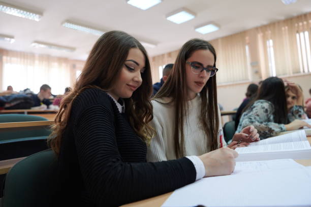 istock Students Gruop In the uni Amphitheather 1310194935
