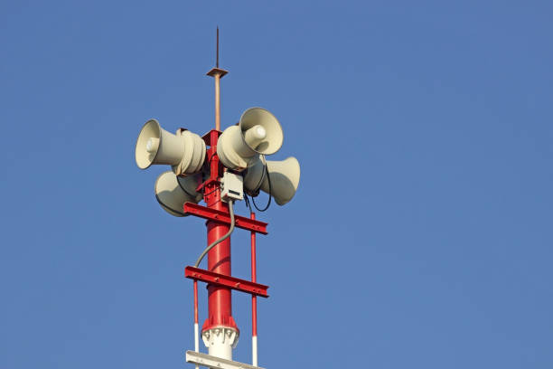 istock Tannoy speakers high up on a red tower 1310196759