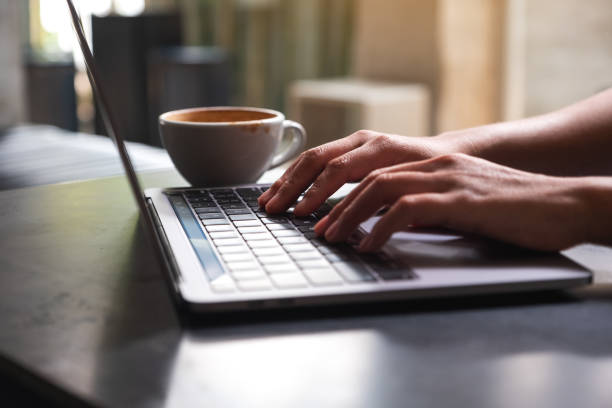 istock a woman working and typing on laptop computer keyboard on the table 1310198328