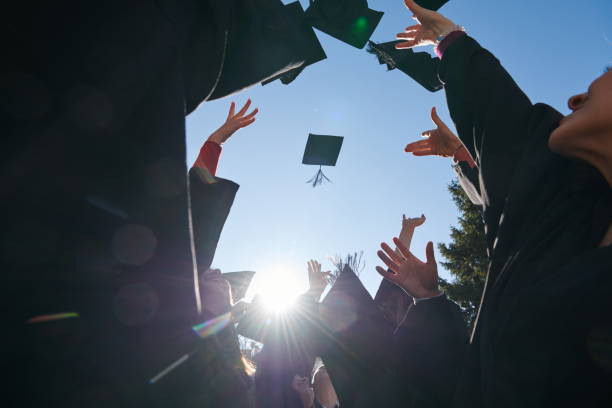 istock Group of diverse international graduating students celebrating 1310199866