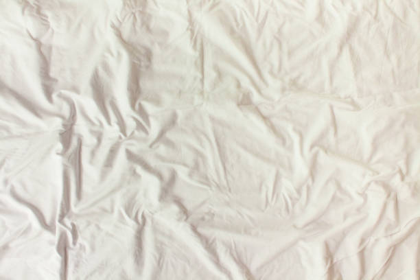 istock Flat layout white background. Modern minimal background with fabric texture and folds of cotton fabric. Top view 1310201344