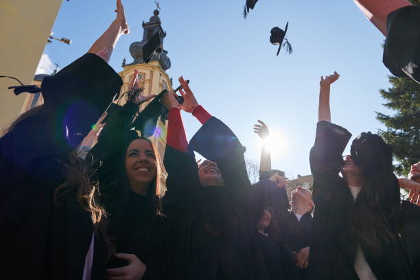 istock Group of diverse international graduating students celebrating 1310202496