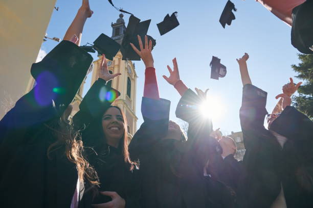 istock Group of diverse international graduating students celebrating 1310203281