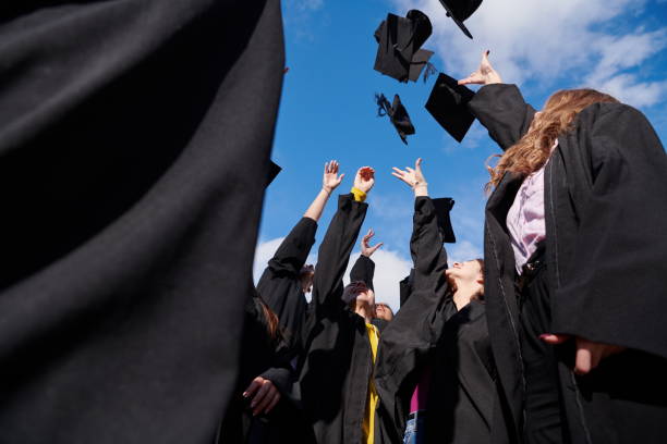 istock Group of diverse international graduating students celebrating 1310203445