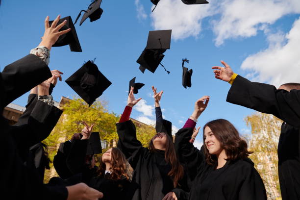 istock Group of diverse international graduating students celebrating 1310204856
