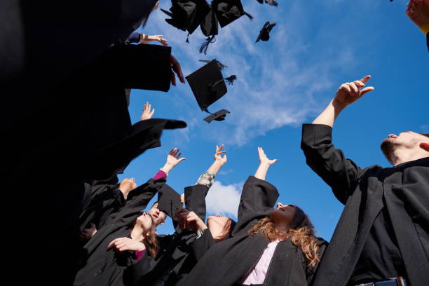 istock Group of diverse international graduating students celebrating 1310206735
