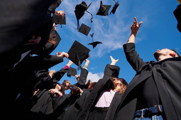 istock Group of diverse international graduating students celebrating 1310206787