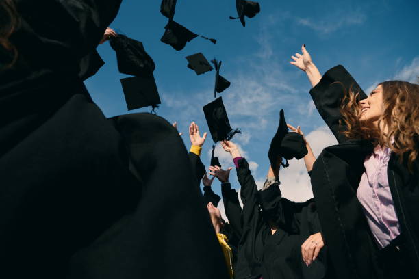 istock Group of diverse international graduating students celebrating 1310206840