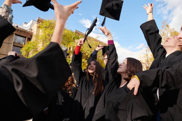 istock Group of diverse international graduating students celebrating 1310206857