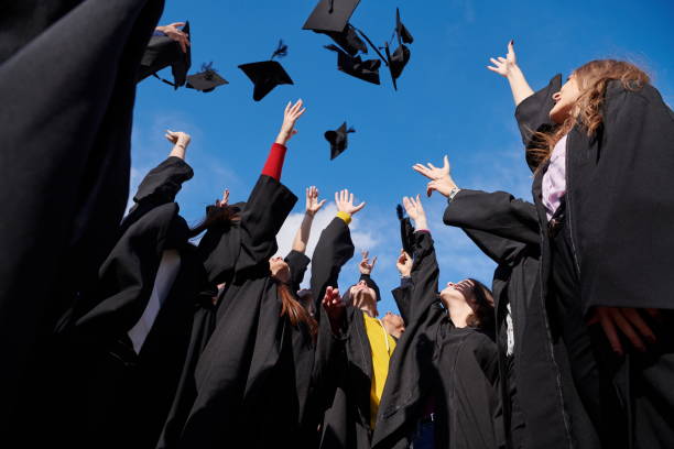 istock Group of diverse international graduating students celebrating 1310209149