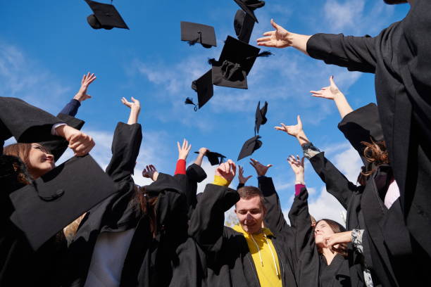 istock Group of diverse international graduating students celebrating 1310209167