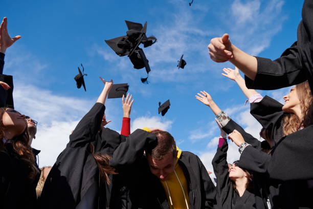 istock Group of diverse international graduating students celebrating 1310209879