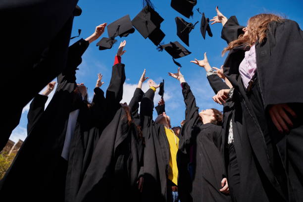 istock Group of diverse international graduating students celebrating 1310209929