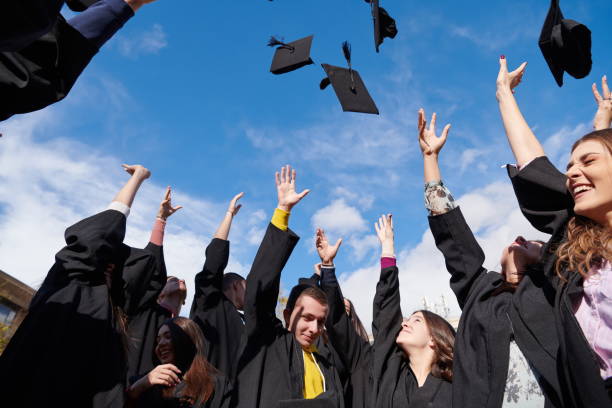 istock Group of diverse international graduating students celebrating 1310209992