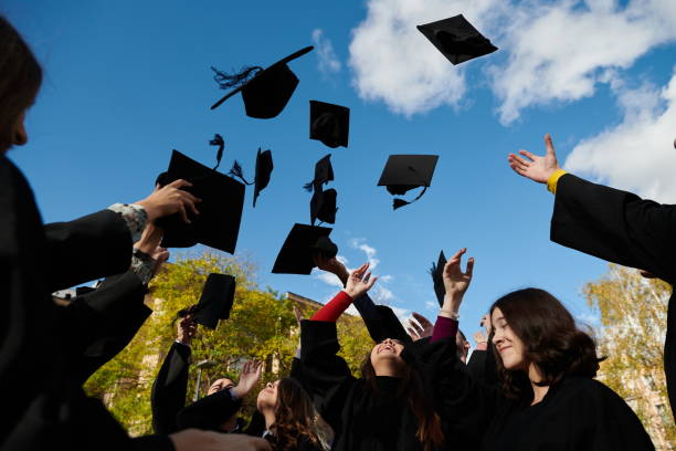 istock Group of diverse international graduating students celebrating 1310211341