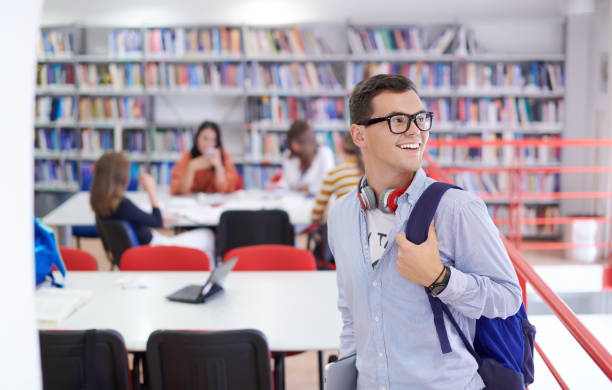 istock the student uses a notebook, latop and a school library 1310212226