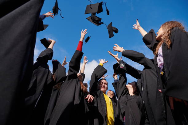 istock Group of diverse international graduating students celebrating 1310212255