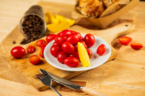 istock Red Ripe Tomatoes Scattered on Wooden Table still life 1310212323