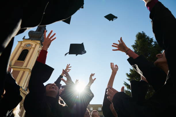 istock Group of diverse international graduating students celebrating 1310213250