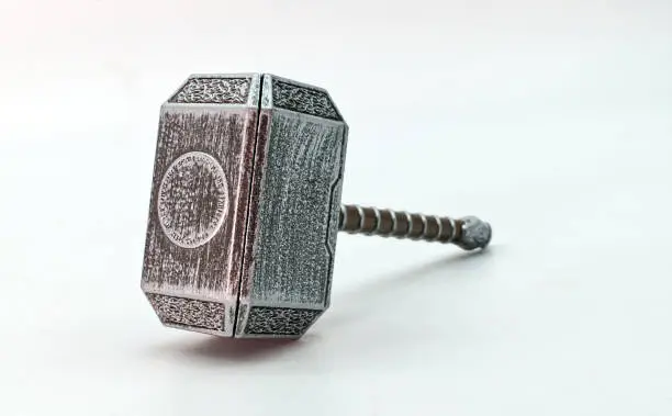 Hammer of Thor, Mjolnir, isolated on white background. The mythical Thors hammer. Thor the God of thunder for Viking people. Mjolnir a legendary Viking weapon. Empty space for text