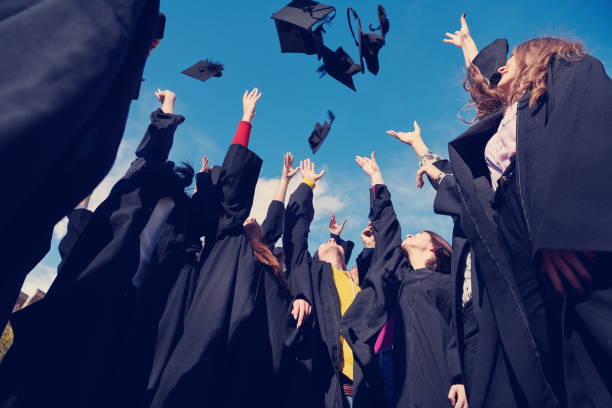 istock Group of diverse international graduating students celebrating 1310215754