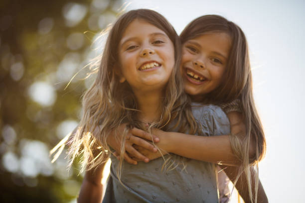 istock Two little girl spending time outside and playing. 1310215998