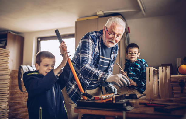 istock grandparents and grandchildren work in the workshop 1310218131